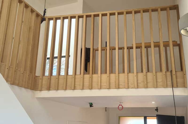 a bespoke wood balcony made by Swilken Joinery